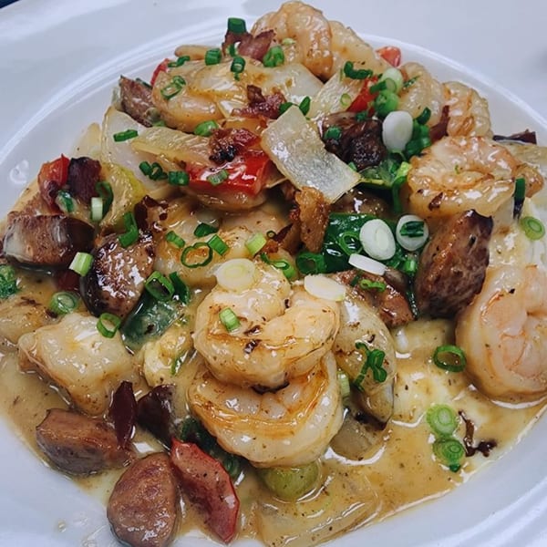 Shrimp and grits with sausage, onions, peppers, and green onions from Georgia Comfort Kitchen.